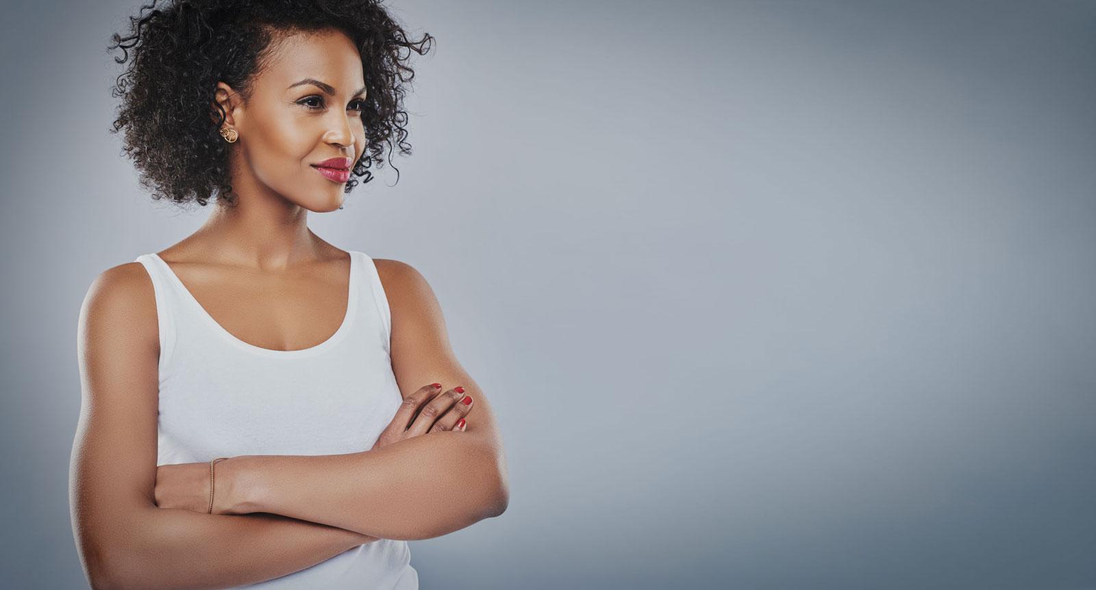 woman with arms crossed looking strong