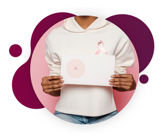 Woman holding illustration of healthy breast tissue. What are breast cancer risk factors? 
