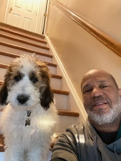 Prostate cancer patient Ron poses for a  photo with his dog.